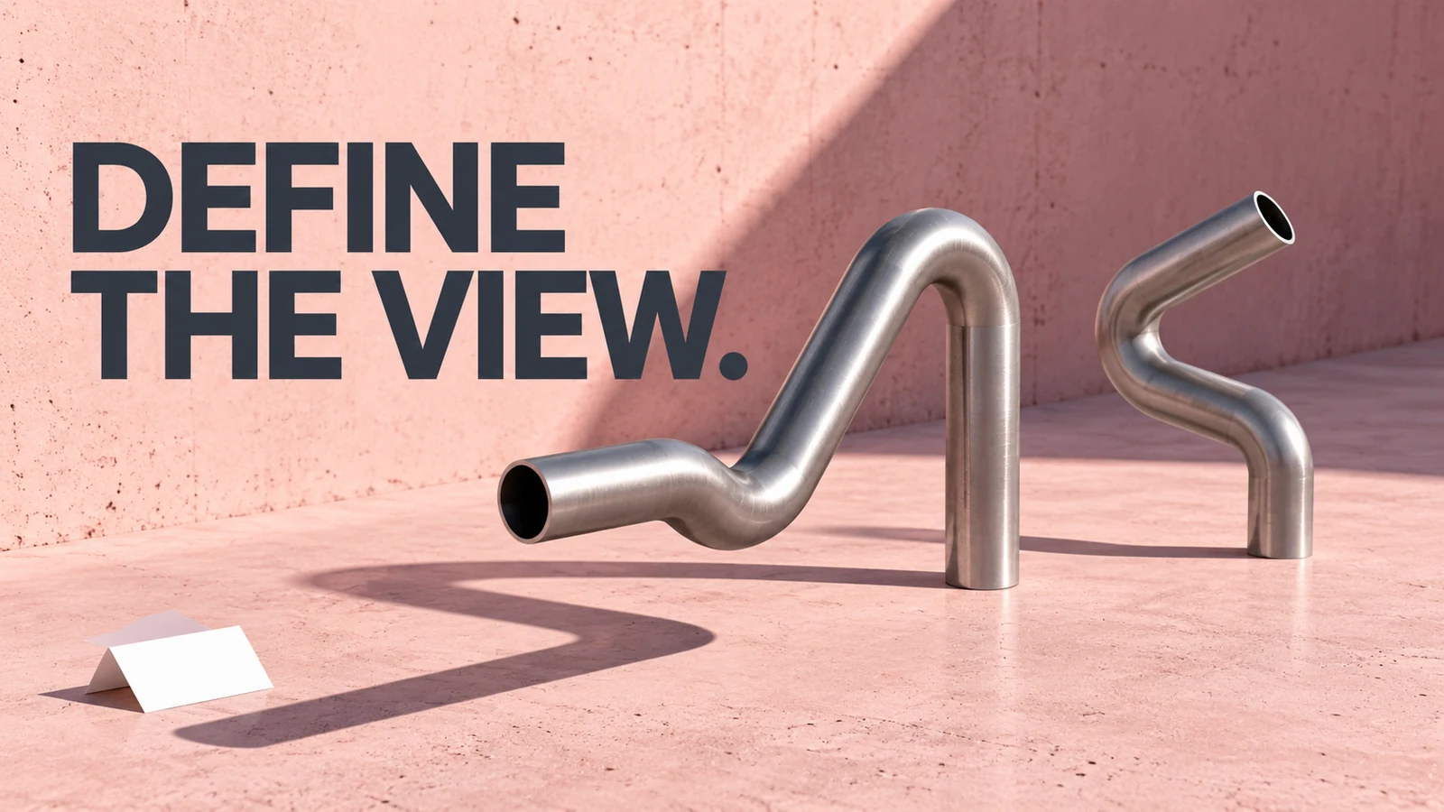 Generic detached bent metal tube sculptures on a blush surface beneath Define the View.